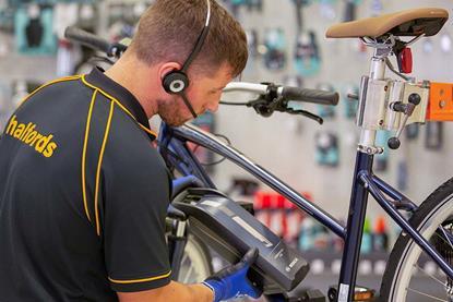 Halfords colleague carrying out an electric bike service
