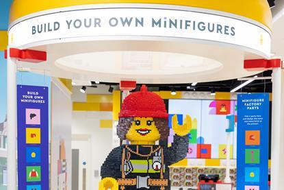 Lego on display at Cribbs shopping centre, Bristol. Sign says: 'Build your own minifigures'