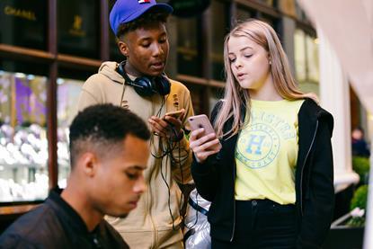Teenagers on their phones