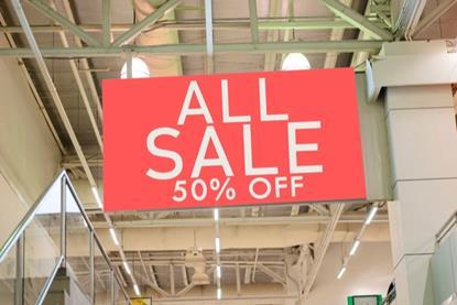 Half price sale sign in store