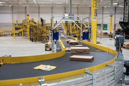 Amazon parcels on conveyor belt at delivery station