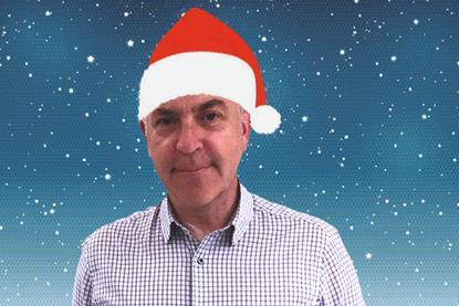 George MacDonald wearing santa hat