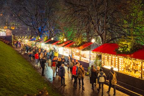 Shoppers in an outdoor Christmas market