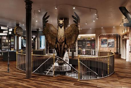 Interior of Harry Potter Store in New York showing a large eagle above a spiral staircase