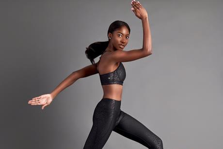 Model running wearing Skims sportswear