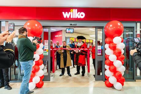 Owner Chris Dawson cutting the ribbon Wilko's Plymouth store