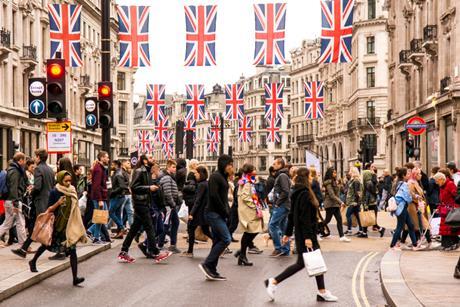 Tourists and shoppers crossing busy Regents Street