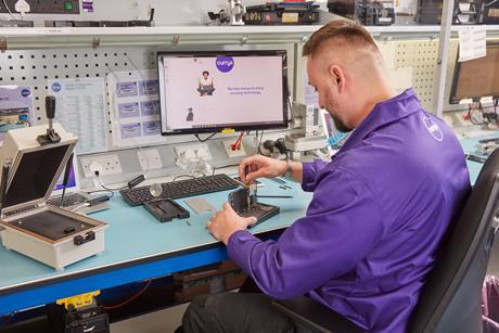 Currys colleague repairing smartphone