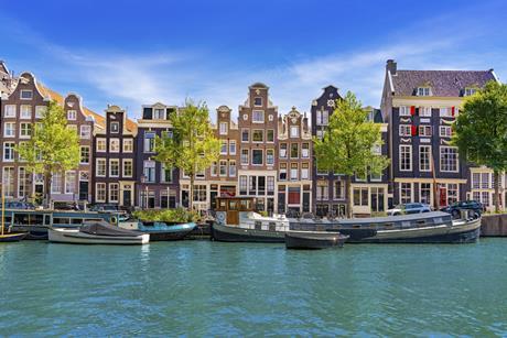 Historic gabled houses along Singel canal in Amsterdam