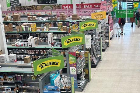 Asda Rollback sings on display in supermarket