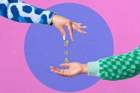 Image of hand dropping coins on another hand-Getty Images-DigitalVision-We Are