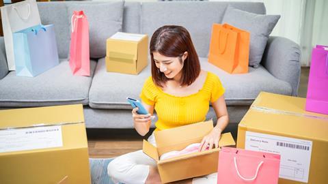 Woman with online delivery boxes