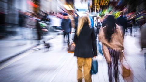 Two-girls-on-blurred-busy-high-street