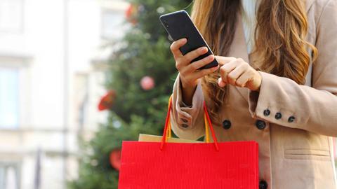 Woman-on-phone-with-shopping-bags