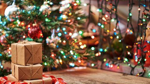 Packages in front of a Christmas tree
