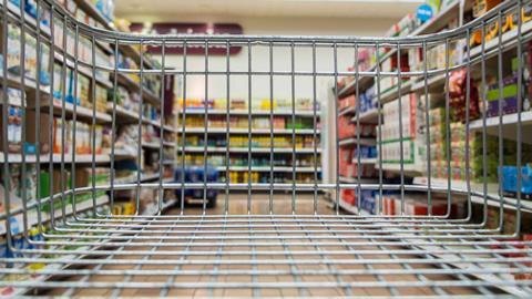 Aldi supermarket aisle shown through back of a trolley