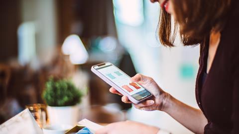 Woman online shopping on her smartphone