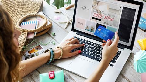 Woman-using-credit-card-to-shop-online
