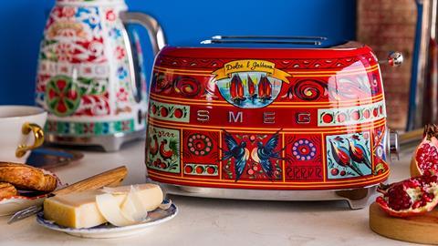 Promo photo showing products from the Smeg x Dolce & Gabbana collection including a kettle, a cup and a toaster