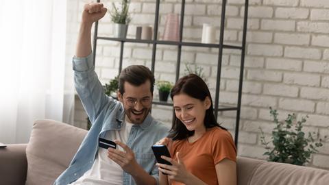 Couple shopping on smartphones