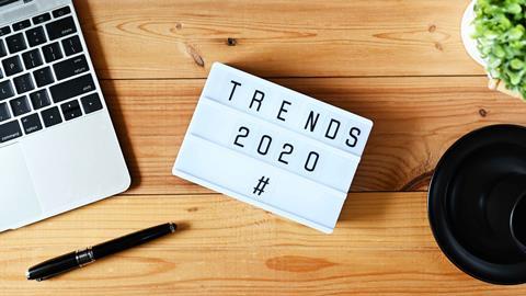 Laptop-plant-and-sign-saying-Trends-2020