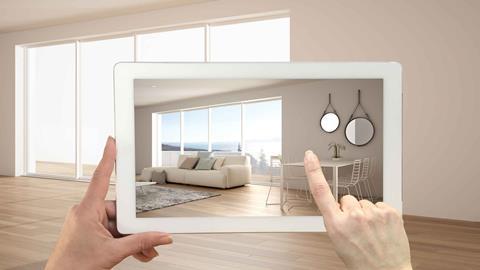 Hands-holding-tablet-featuring-augmented-reality-furniture-app