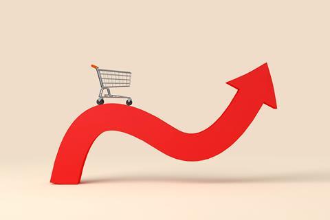 Illustration of shopping trolley balanced on top or rising graph
