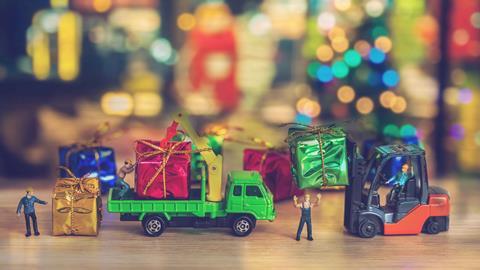 Toy-delivery-men-with-toy-lorries-and-presents