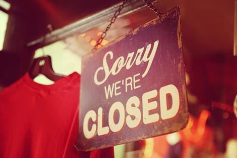 Closed sign in clothes shop index