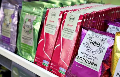 Holland & Barrett products on a shelf (popcorn and confectionery)