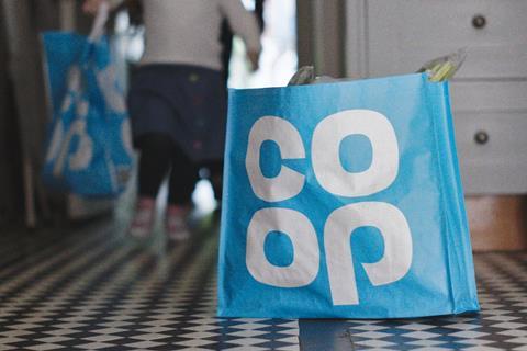 Co-op bag full of groceries on kitchen floor