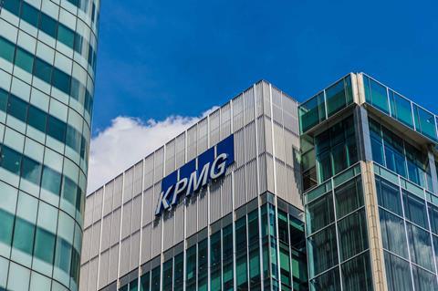 KPMG building in Canary Wharf flanked by two other skyscrapers