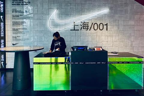 Worker at the checkout of the Nike store Shanghai