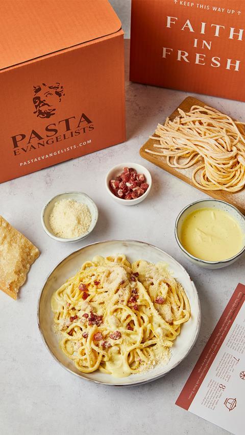 Pasta Evangelists delivery box with styled shot of pasta meal next to it