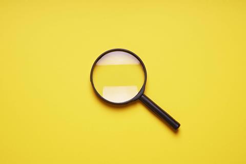Magnifying-glass-on-yellow-background