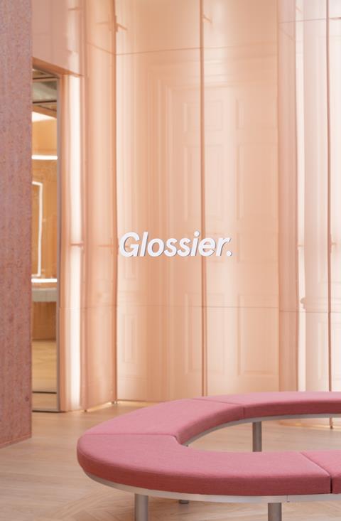 Glossier interior with bench