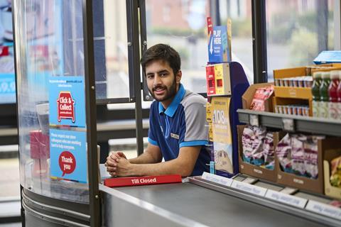 Aldi worker at checkout