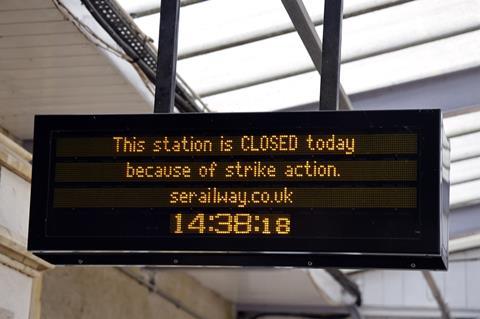 Rail strike notice on electronic information board at station