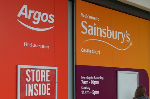 In-store signs for Sainsbury's and Argos