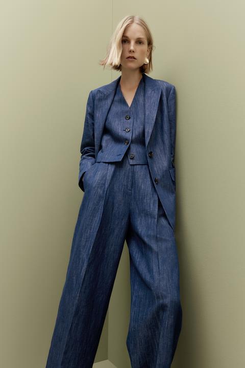 Female model wearing Marks & Spencer suit