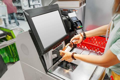 Woman at self checkout