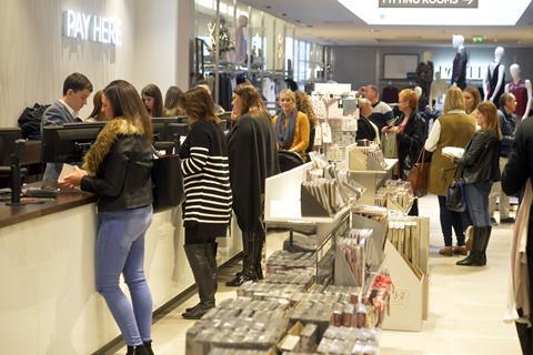 Shoppers  till  cash point  paying