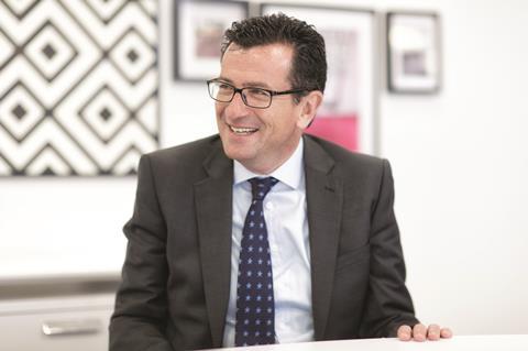 Carpetright boss Wilf Walsh was pleased by a return to quarterly sales growth