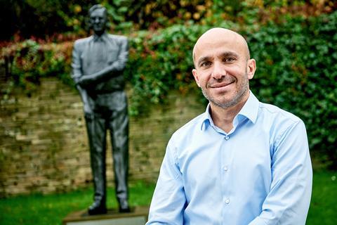 Rami Baitiéh in front of Sir Ken Morrison statue