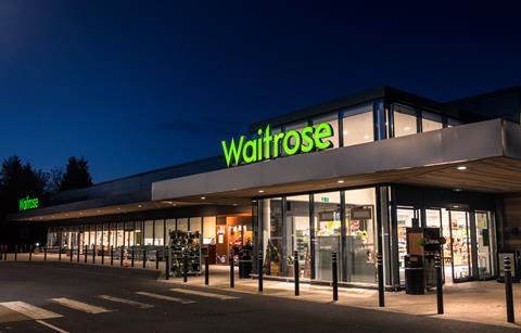 Exterior of Waitrose store at night