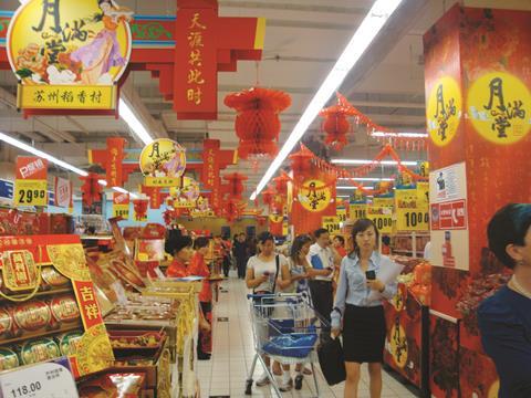 China’s second largest grocer, China Resources Enterprise (CRE), has posted its first full-year loss for more than a decade as tough market conditions begin to bite.