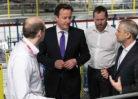 David Cameron, pictured with Ocado boss Tim Steiner, has been accused of 
