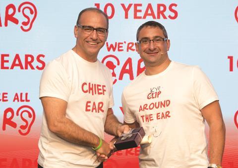 Theo presents Kypros with an award for his  10 years of service at the group’s annual conference