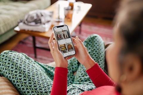 Woman looking at Vinted app