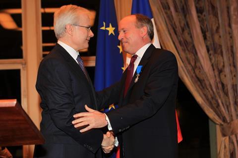 Ian Cheshire receives the insignia from Bernard Emie, French Ambassador to the UK